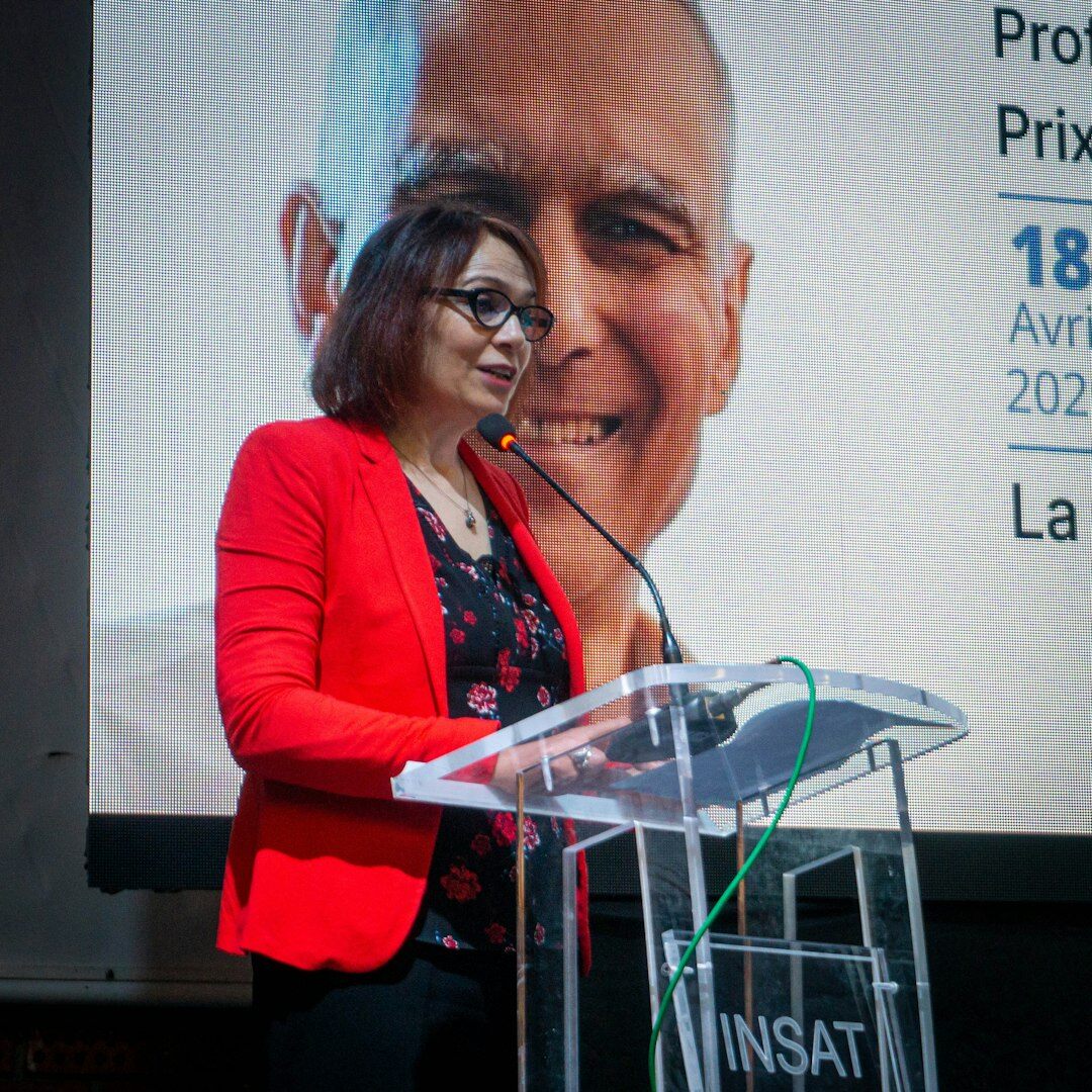 woman giving speech at podium